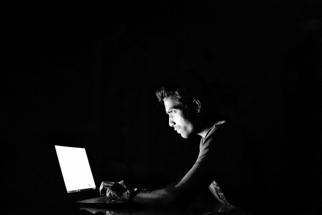 Hacker working on laptop